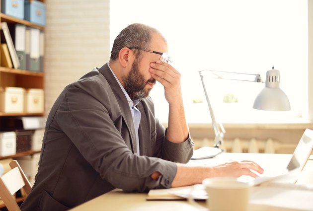 Mature Adult man working in the office