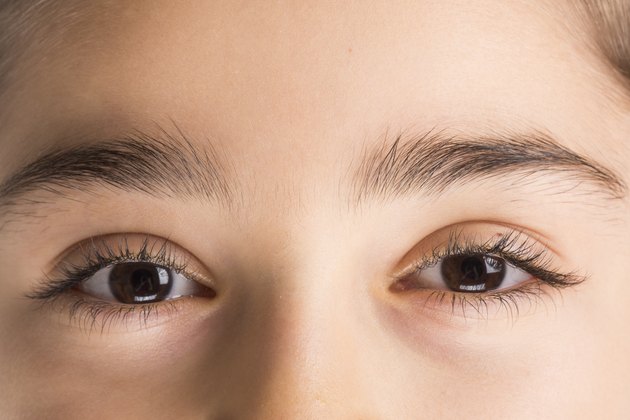 Close-up image of of brown eye and eyelashes