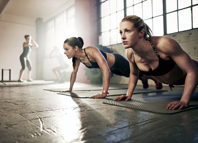 Group of strong women working out in gym
