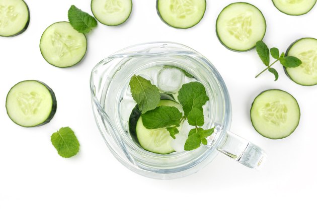 Cucumber and mint lemonade in a jar on a white background with place for text