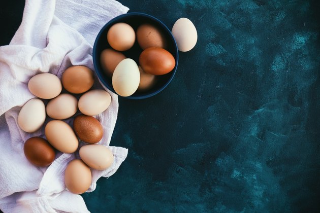 Farm fresh eggs on background, view from above.