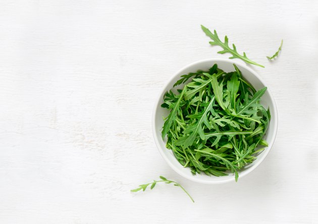 Arugula in a white bowl
