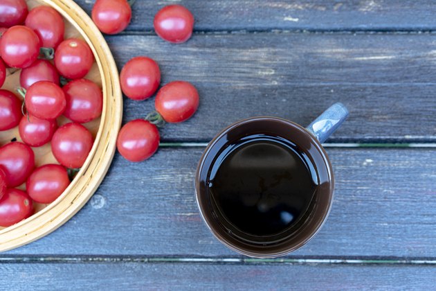 Black coffee and fresh cherry tomato