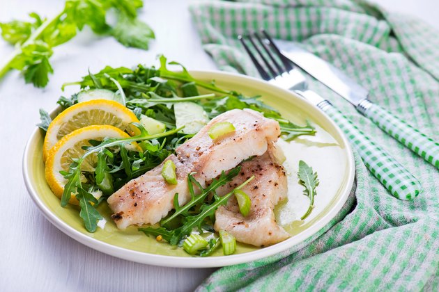 Slice steamed fish with spicy sauce and salad