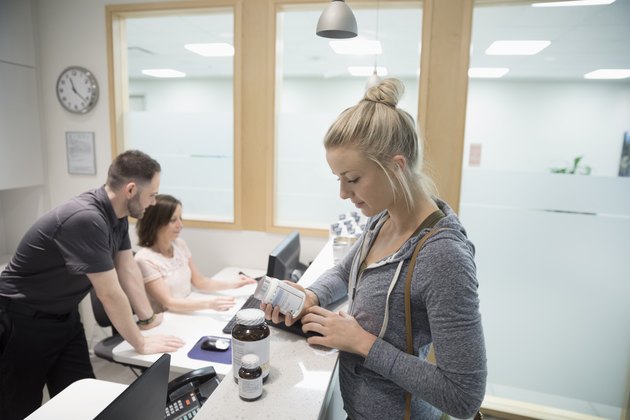 Woman purchasing supplements at physiotherapy clinic