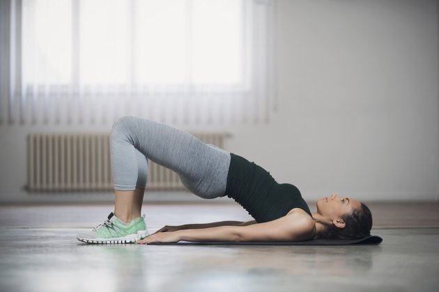 woman doing glute bridge for stronger gluteus maximus muscles