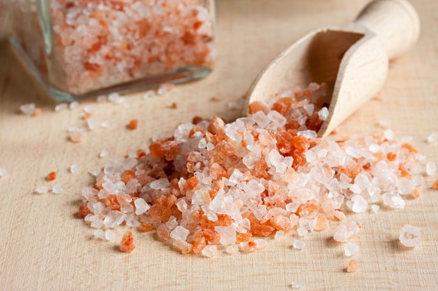 Pink Himalayan sea salt on a wooden background