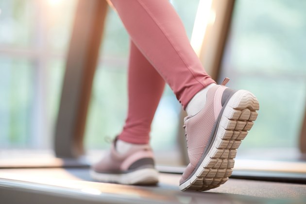 Feet walking on a treadmill