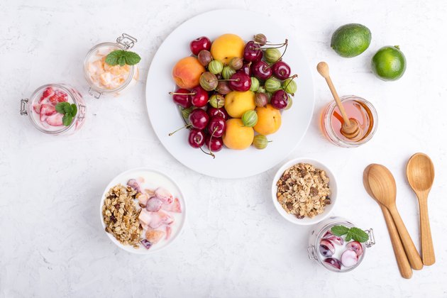Healthy breakfast with granola and fresh summer fruits