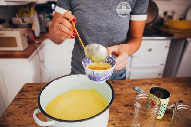 Young woman serving golden milk