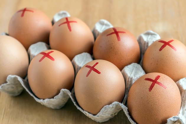 Brown farm eggs marked with red crosses because of a food recall