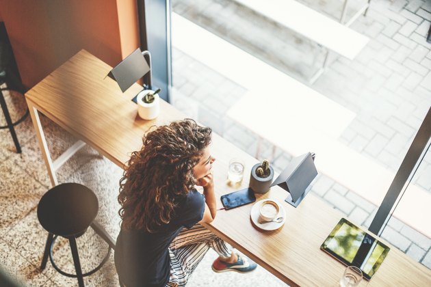 Woman in cafe, top view