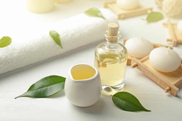 Spa composition with tea tree oil on white background