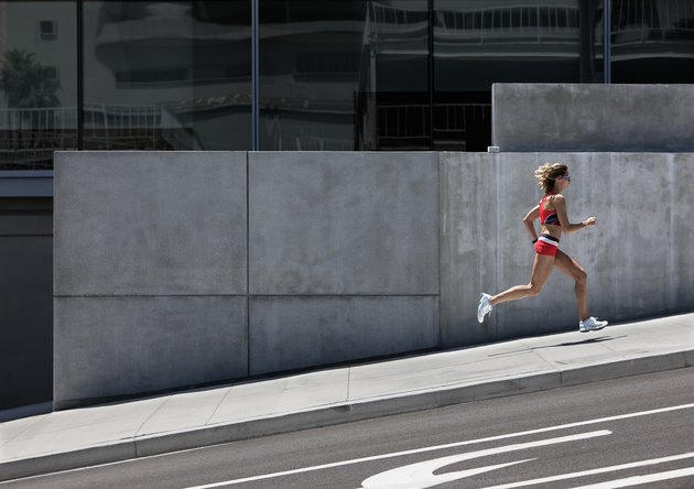 Young woman running in the city