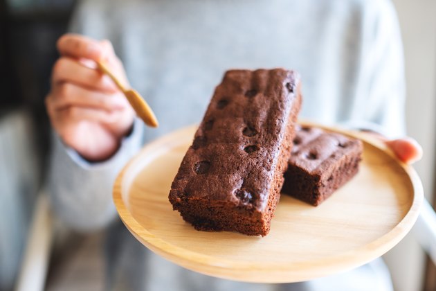 Woman eating brownie dessert made with invert sugar