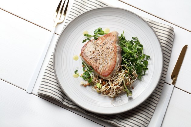 Grilled tuna with young pea sprouts, lentils and beans