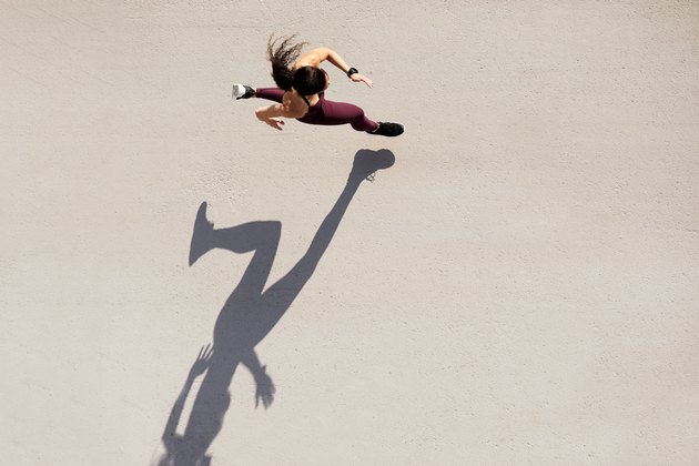 Sprinter seen from above with shadow and copy space.