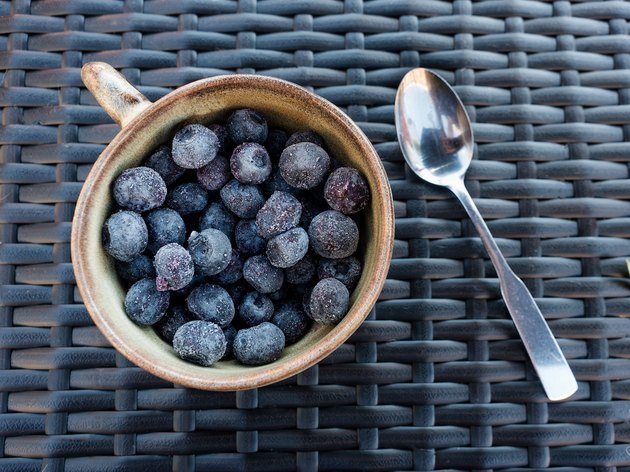 Close-Up of Blueberries in Cup on Wicker Mat