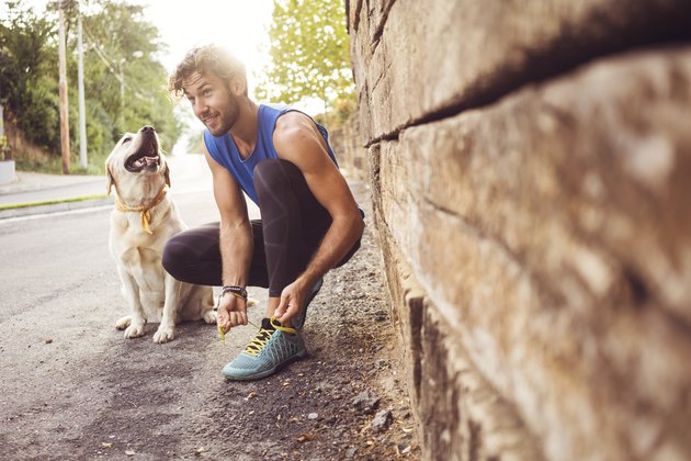 Man jogging with dog best friend