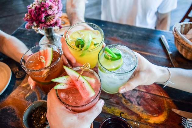 Friends toasting with healthy cocktails