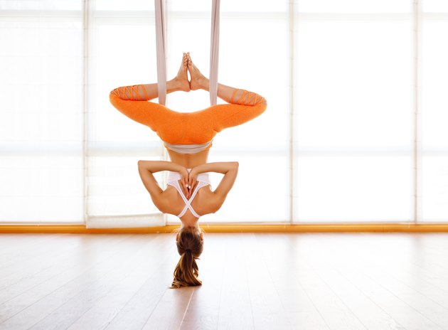 woman doing of Aero yoga of antigravity in hammock