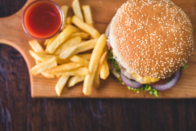 Homemade burgers on rustic wooden background