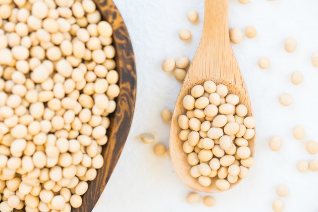 Directly Above Shot Of Soybeans In Heart Shape Bowl Over White Background