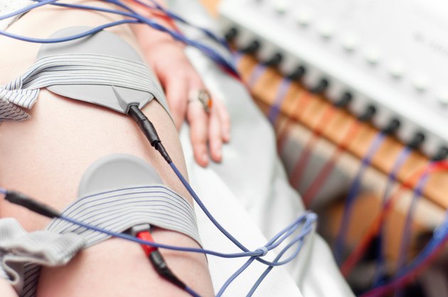 woman wired up on electrostimulation device