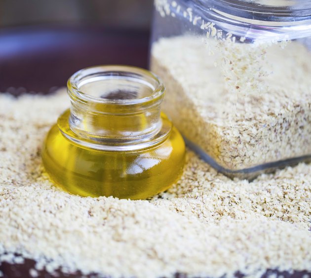 Wheat germ oil , closeup of wheat germ oil transparent bottle with wheat germ jar. healthy food ingredient