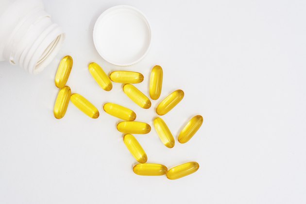 Fish Oil Capsules Spilling From Bottle
