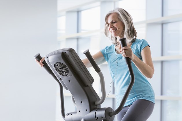 A woman doing an elliptical workout for weight loss