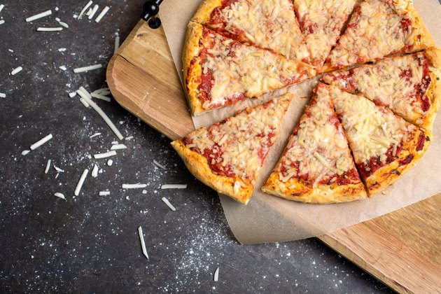 Homemade Pizza Made with Vegan Cheese on Black Background