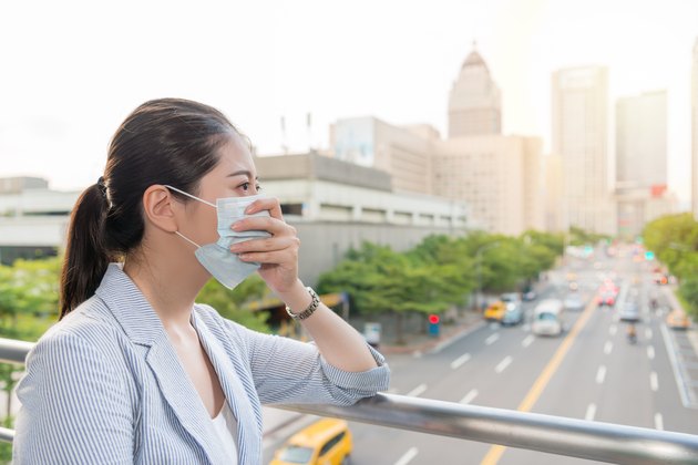 businesswoman feels allergy from bad air