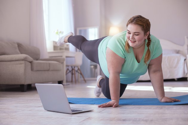 Woman following along with online at-home workout