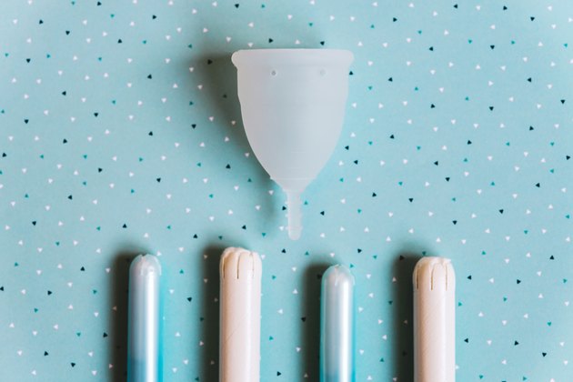 Menstrual cup on blue background