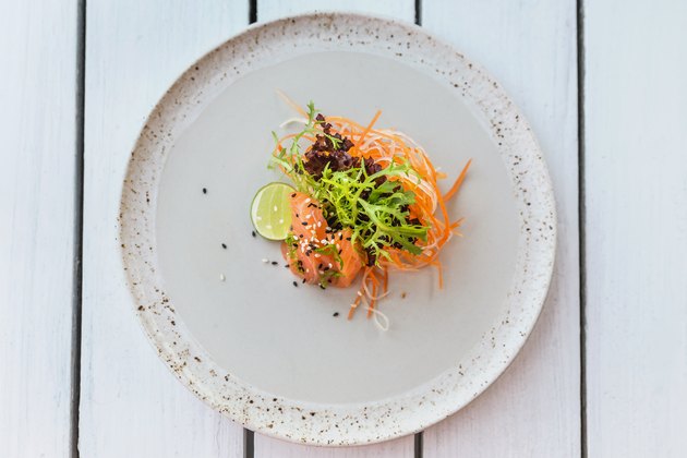 Healthy salmon sashimi and fresh salad