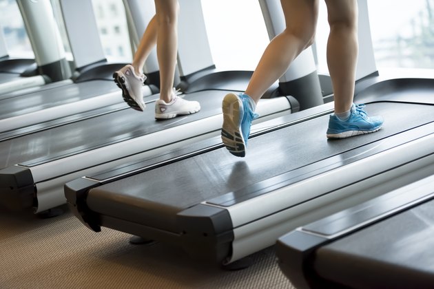 Two women running on the treadmills