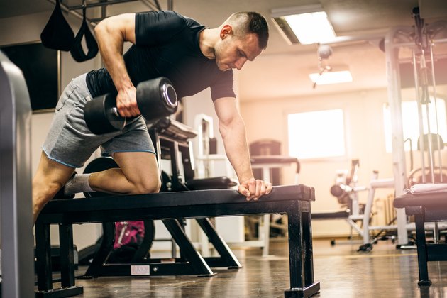 Healty Man Exercising with Arm Weights