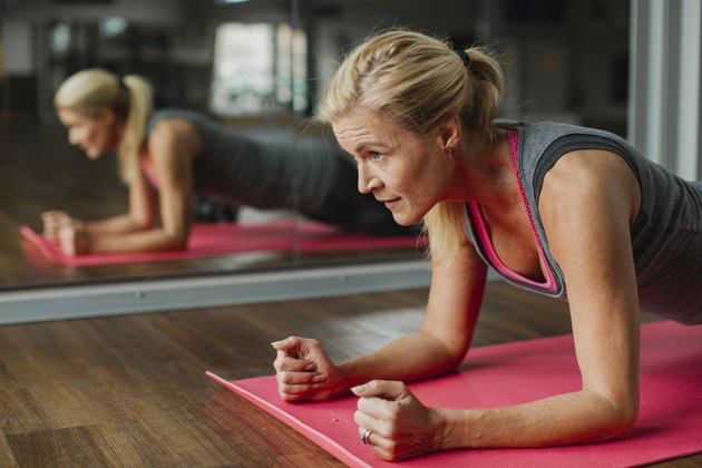 Woman exercising on mat