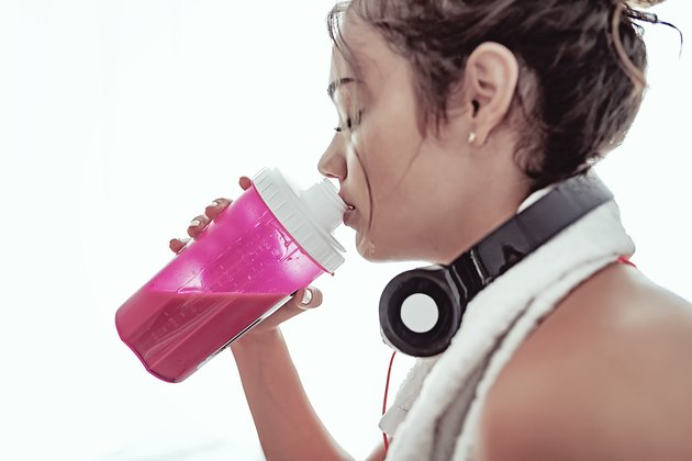 Woman drinking protein powder shake
