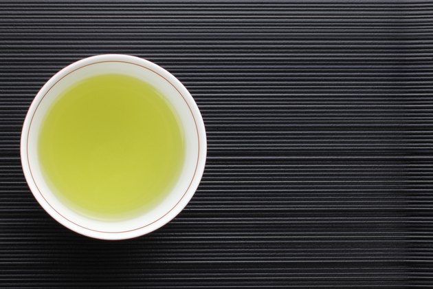 View from looking down into a cup of green tea in a cup