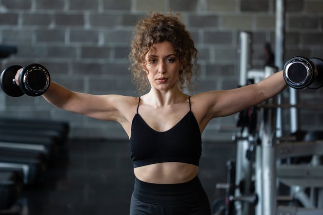 Woman exercising in gym.