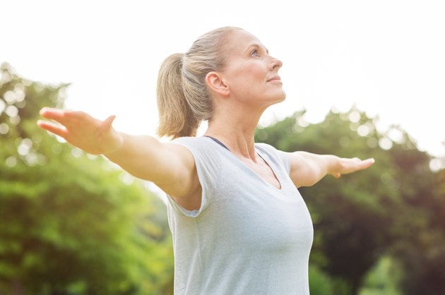 Mature woman practicing arthritis yoga