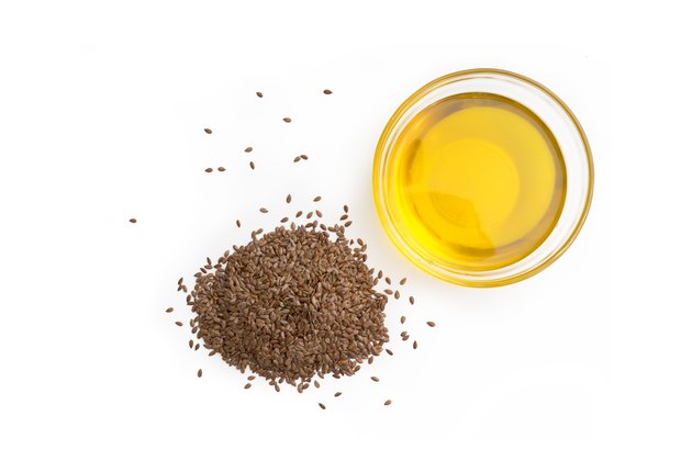 Linseed (flax seed oil) isolated on white background