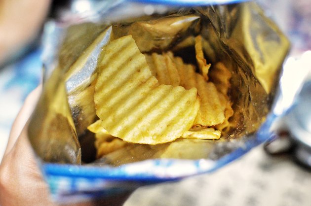 Top view of an open bag of potato chips