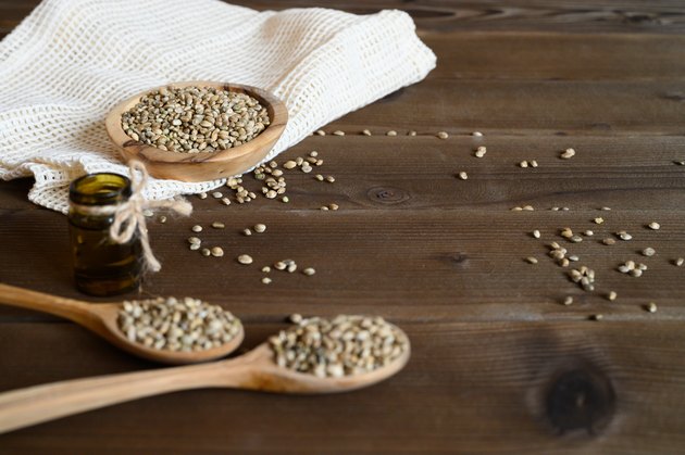 hemp seeds on a wooden background as a healthy food concept