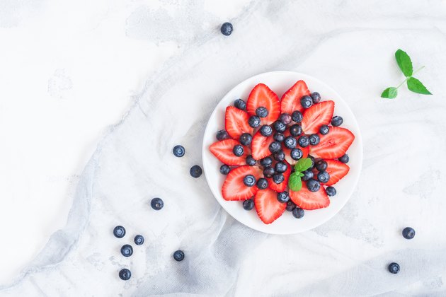 Fruit salad with strawberry and blueberry. Flat lay, top view
