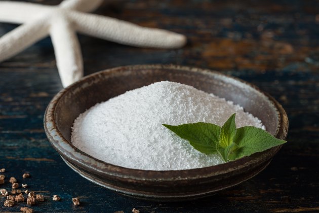 Close-Up Of Epsom Salts In Bowl On Wooden Table