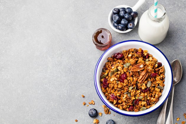 Healthy breakfast. Fresh granola, muesli with pumpkin, pecans, maple syrup