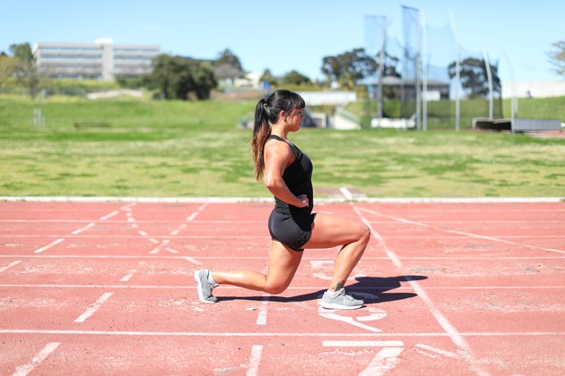a Fit young woman training at the track.